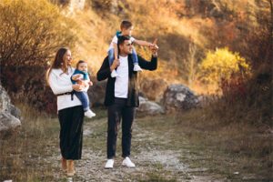 young-family-with-two-sons-together-outside-park-2